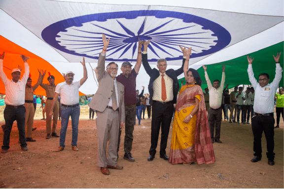 group of people holding flag